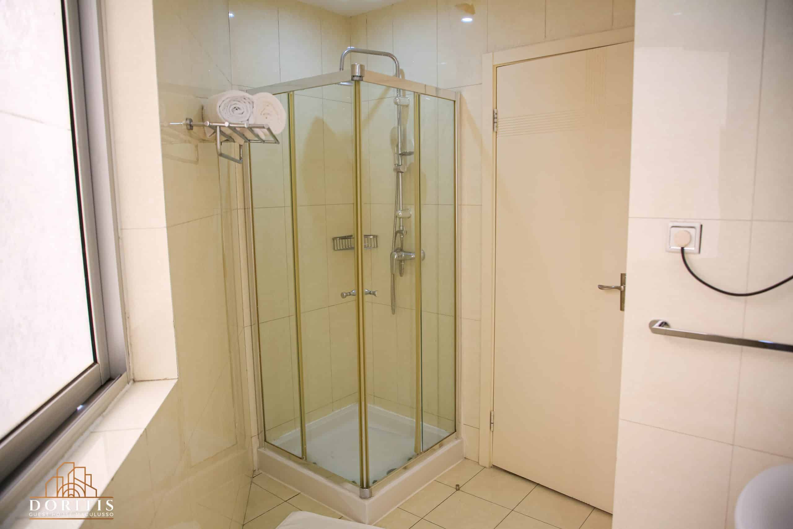 Modern bathroom with glass shower and sleek tile design